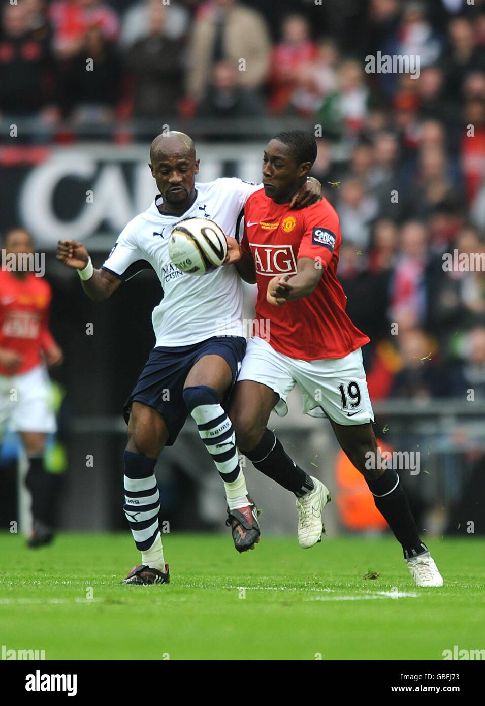 Soccer - Carling Cup - Final - Manchester United v Tottenham Hotspur - Wembley Stadium. Tottenham Hotspur's Didier Zokora (left) and Manchester United's Danny Welbeck (right) battle for the ball Stock Photo