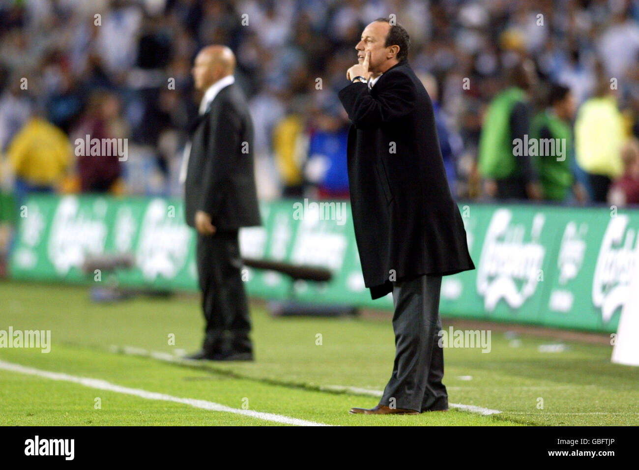 Valencia's coach Rafael Benitez (r) with Olympique Marseille's coach Jose Anigo in the background Stock Photo