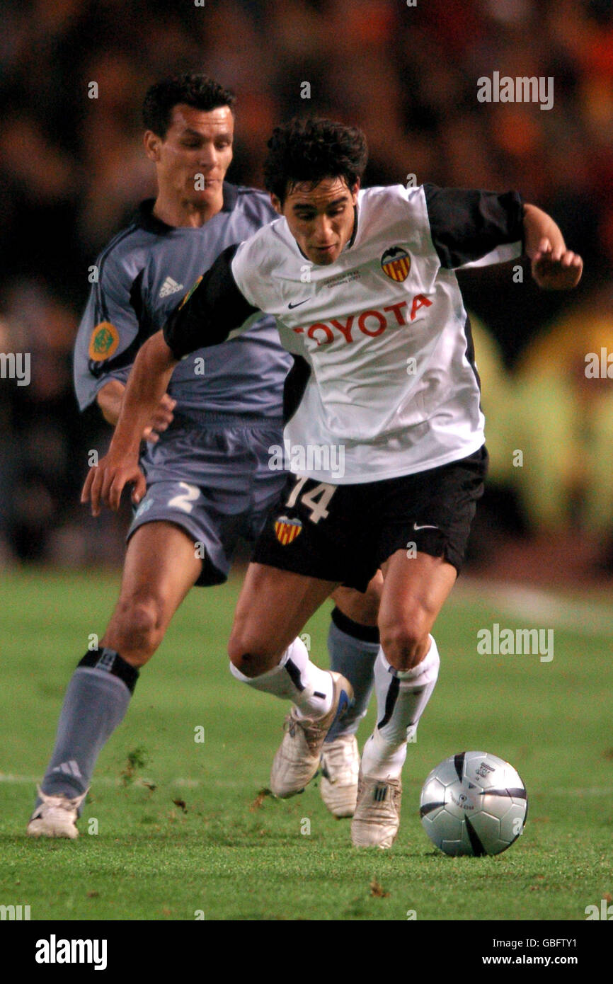 Valencia's Rodriguez Vicente goes past Olympique Marseille's Demetrius Ferreira (l) Stock Photo