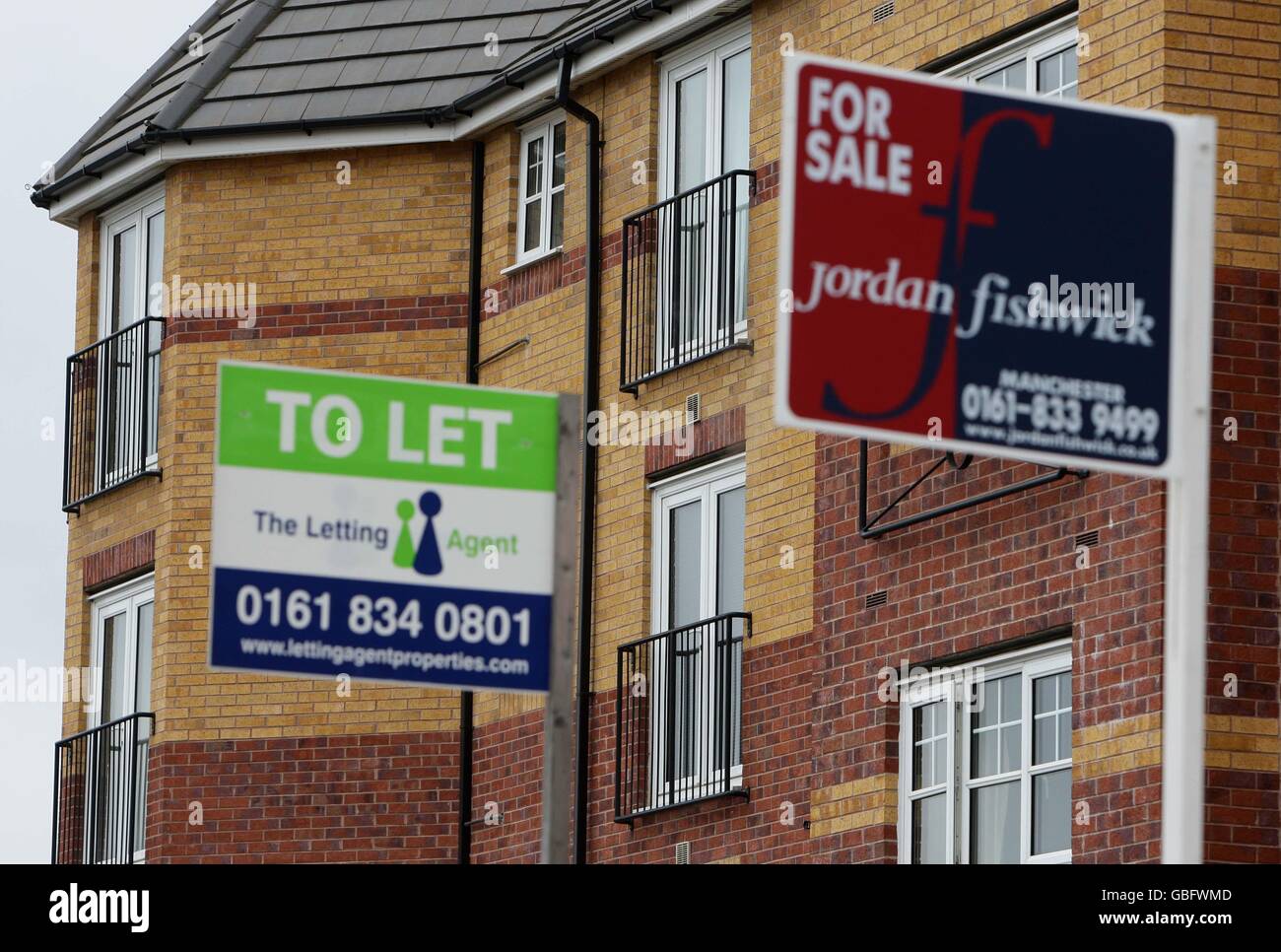 Generic photo of estate agents boards outside flats in Salford, Greater