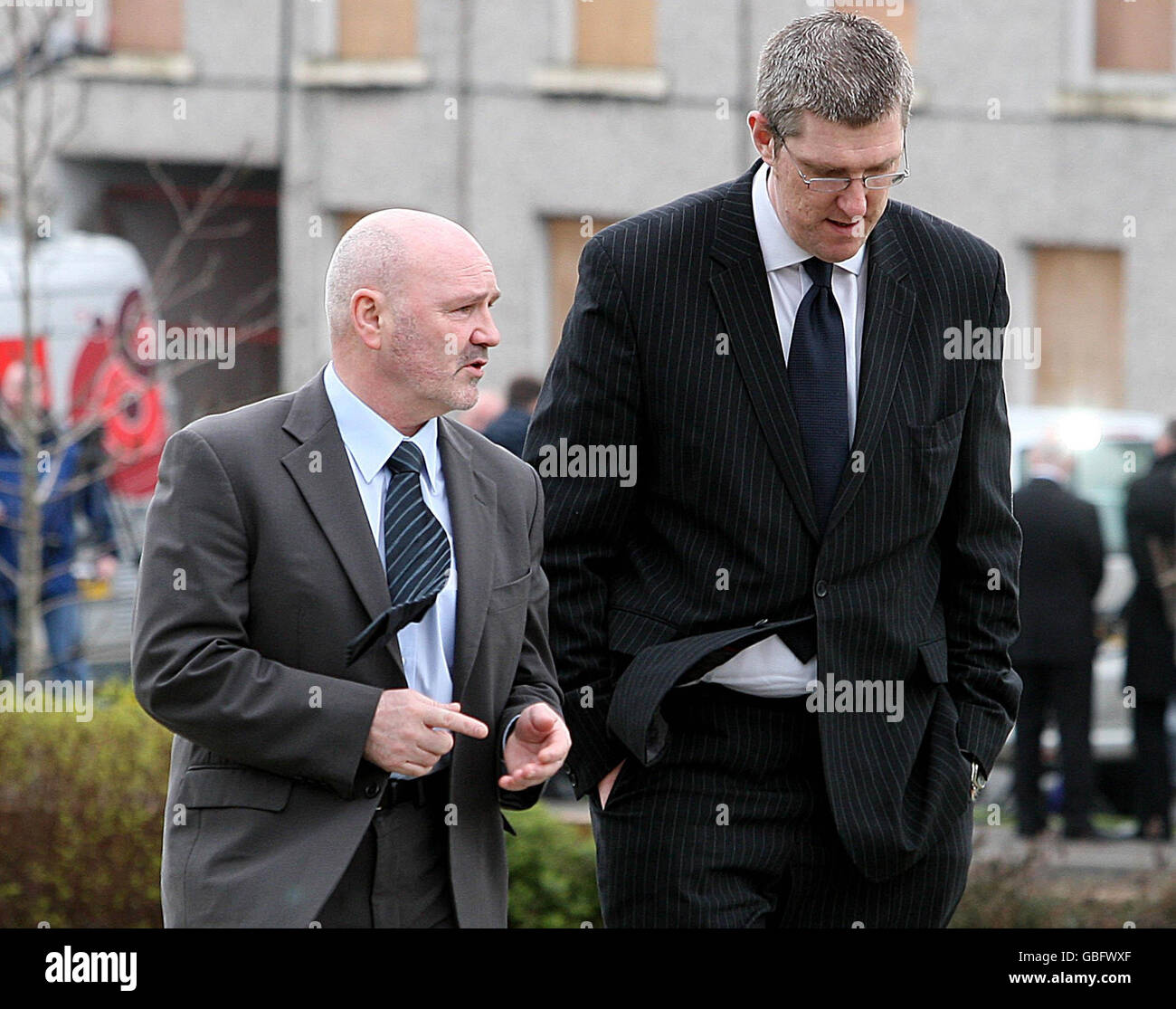 Sinn Feins Alex Maskey, left and MLA John O'Dowd arrive at St Therese's