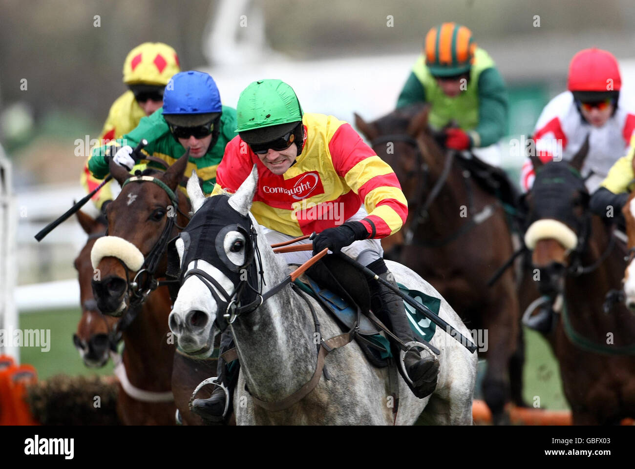 Ruby Walsh on American Trilogy (green cap) pulls away after the final hurdle to win the Vincent O'Brien County Handicap Hurdle at Cheltenham Racecourse, Cheltenham. Stock Photo