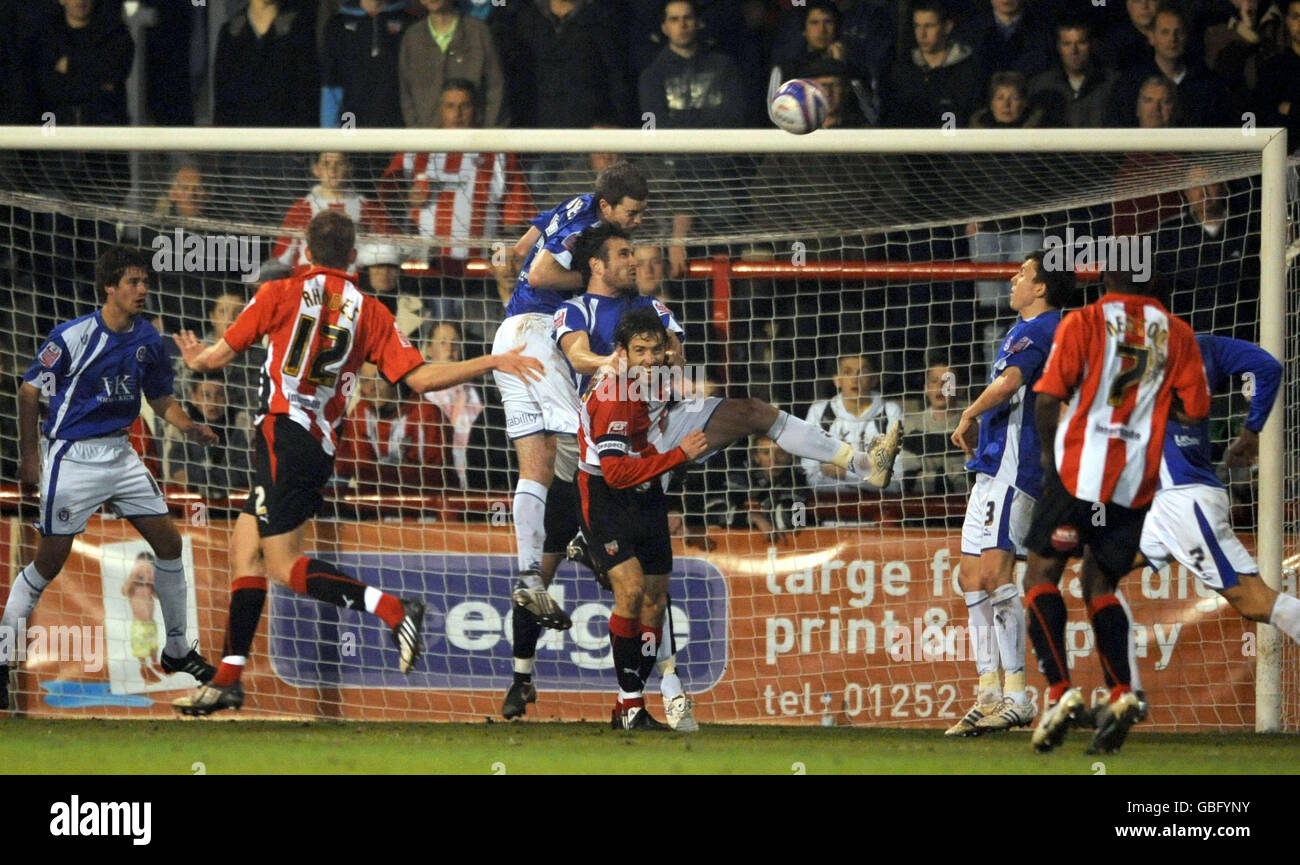 Chesterfield's Aaron Downes (centre above) rises highest to clear a Brentford corner during the Coca-Cola League Two match at Griffin Park, Brentford. Stock Photo