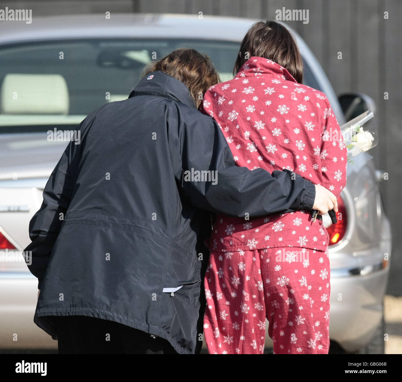 Jackiey Budden, the mother of Jade Goody, comforted by a nurse outside her daughter's house in Waltham Abbey, Essex. Stock Photo