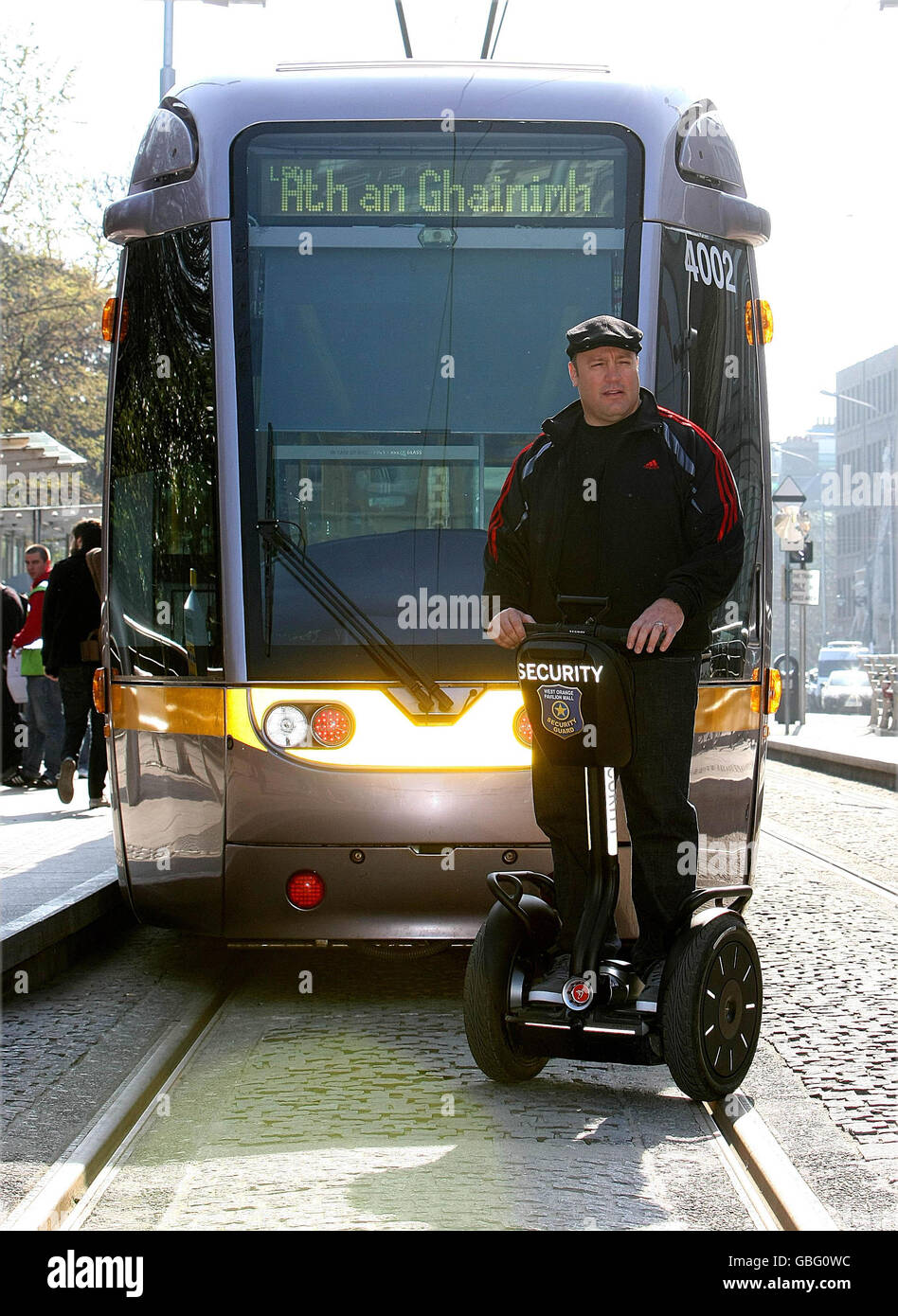 Actor Kevin James riding a Segway in front of a Luas on St.Stephens Green. James, is in Dublin to promote the new Hollywood film 'Paul Blart Mall Cop'. Stock Photo
