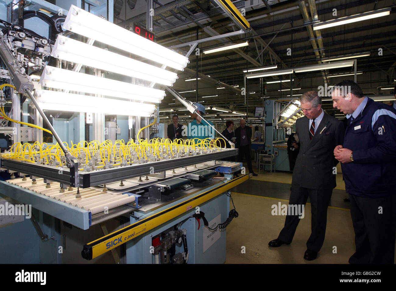 The Prince of Wales with Gordon Butler General Manager of the Solar Division during a factory tour of Sharp Manufacturing Company, Llay, Wrexham, north Wales. Stock Photo