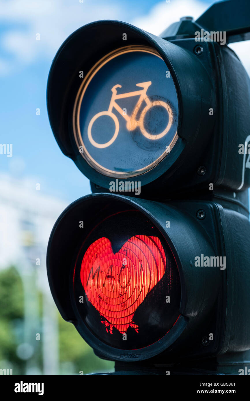 Detail of red stop light at  traffic lights for cyclists with red love heart in Berlin Germany Stock Photo