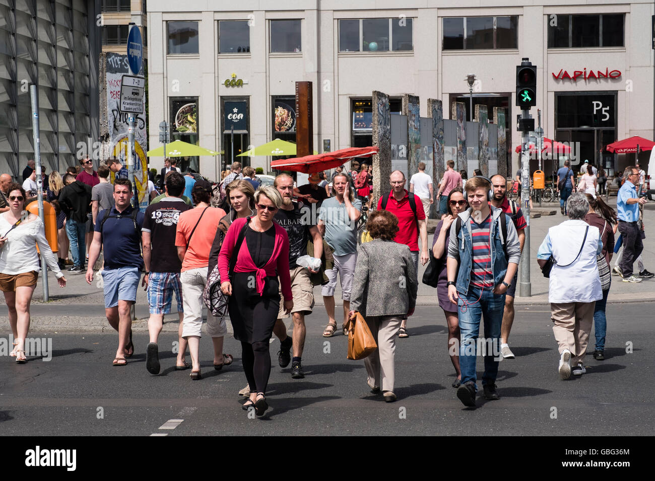 View of pedestrians crossing street at Potsdamer Platz in Berlin Germany Stock Photo