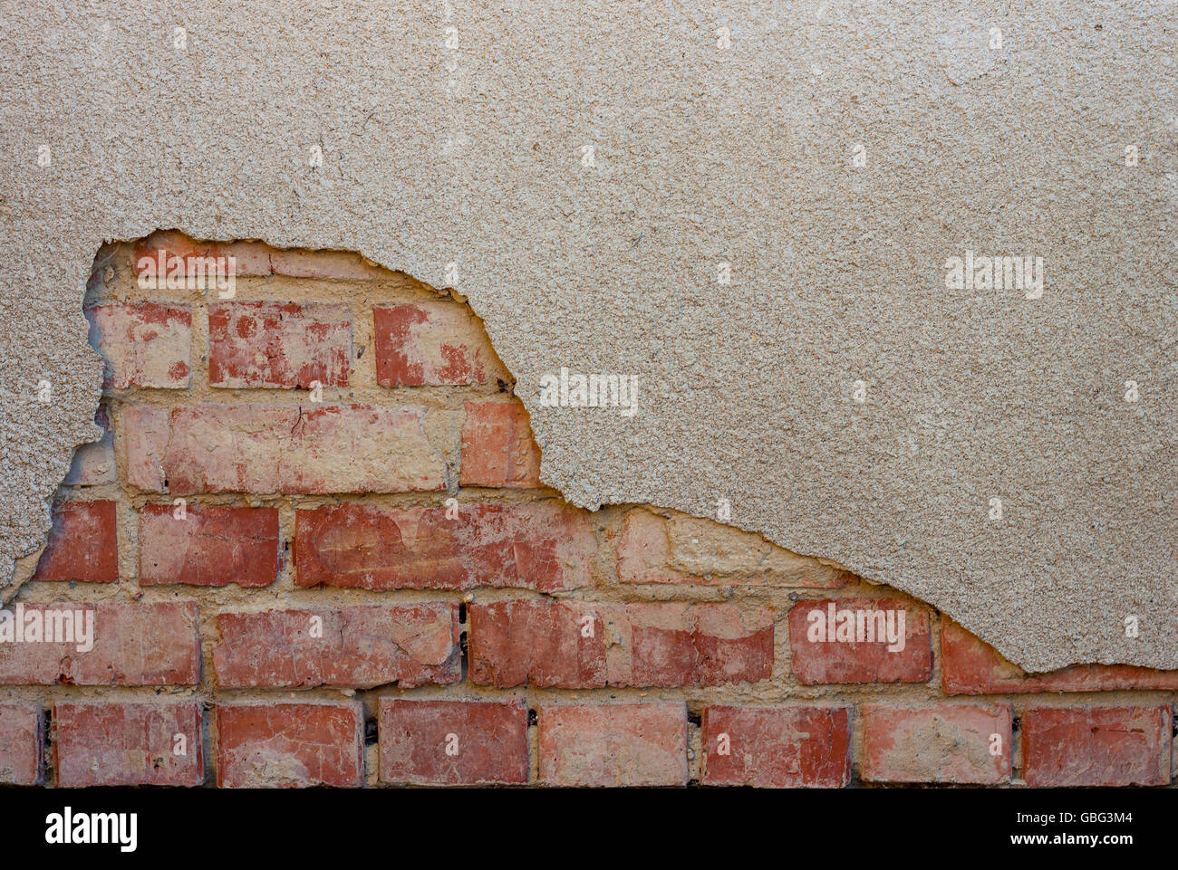 Old cracked plaster brick wall background Stock Photo - Alamy
