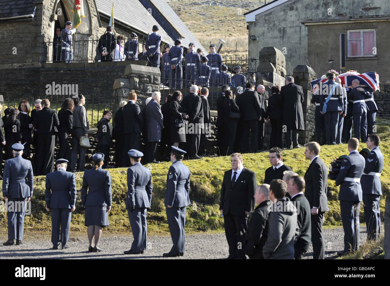 RAF personnel carry the flag-draped coffin of air cadet Katie-Jo Davies, 14, at her funeral at St Barnabas Church, High Street, Gilfach Goch in South Wales. Stock Photo