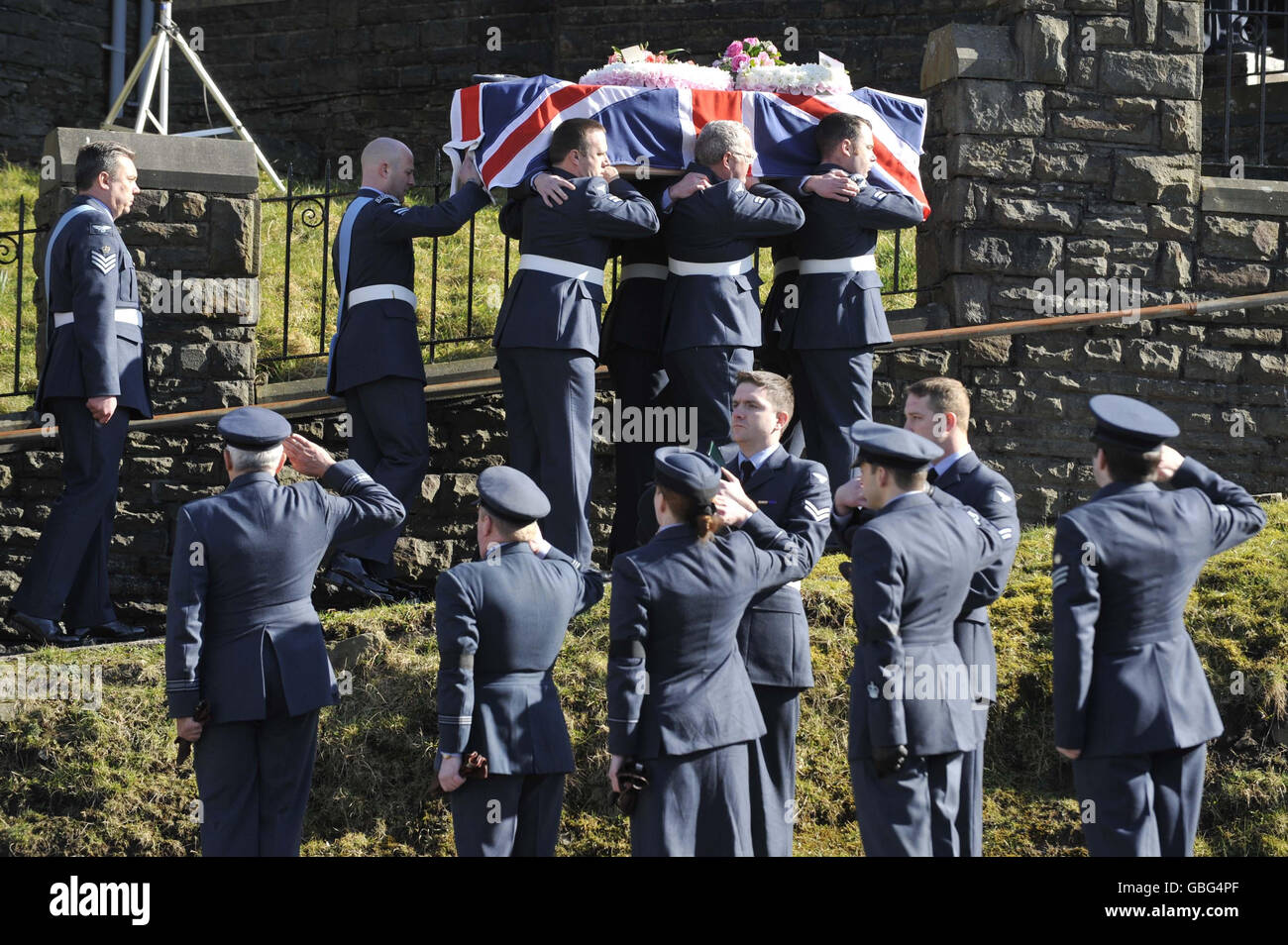 RAF personnel carry the flag-draped coffin of air cadet Katie-Jo Davies, 14, at her funeral at St Barnabas Church, High Street, Gilfach Goch in South Wales. Stock Photo