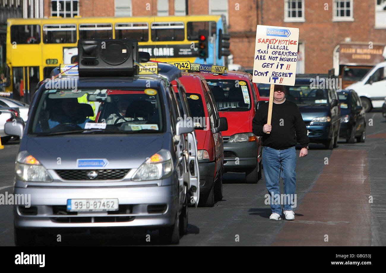 A Taxi Driver Carries A Banner During A Protest For Better Regulation Stock Photo Alamy