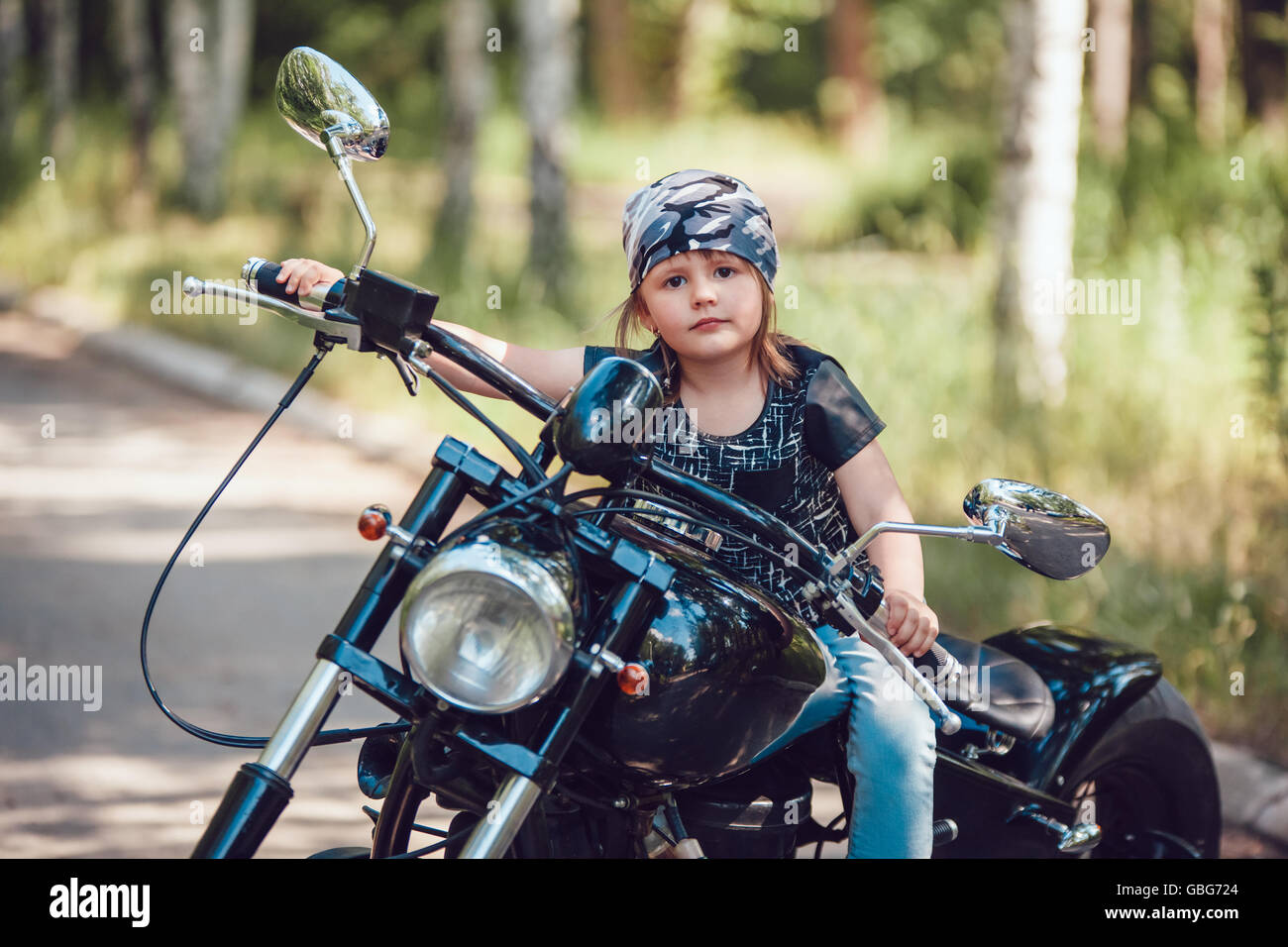 Little girl on a motorcycle Stock Photo - Alamy