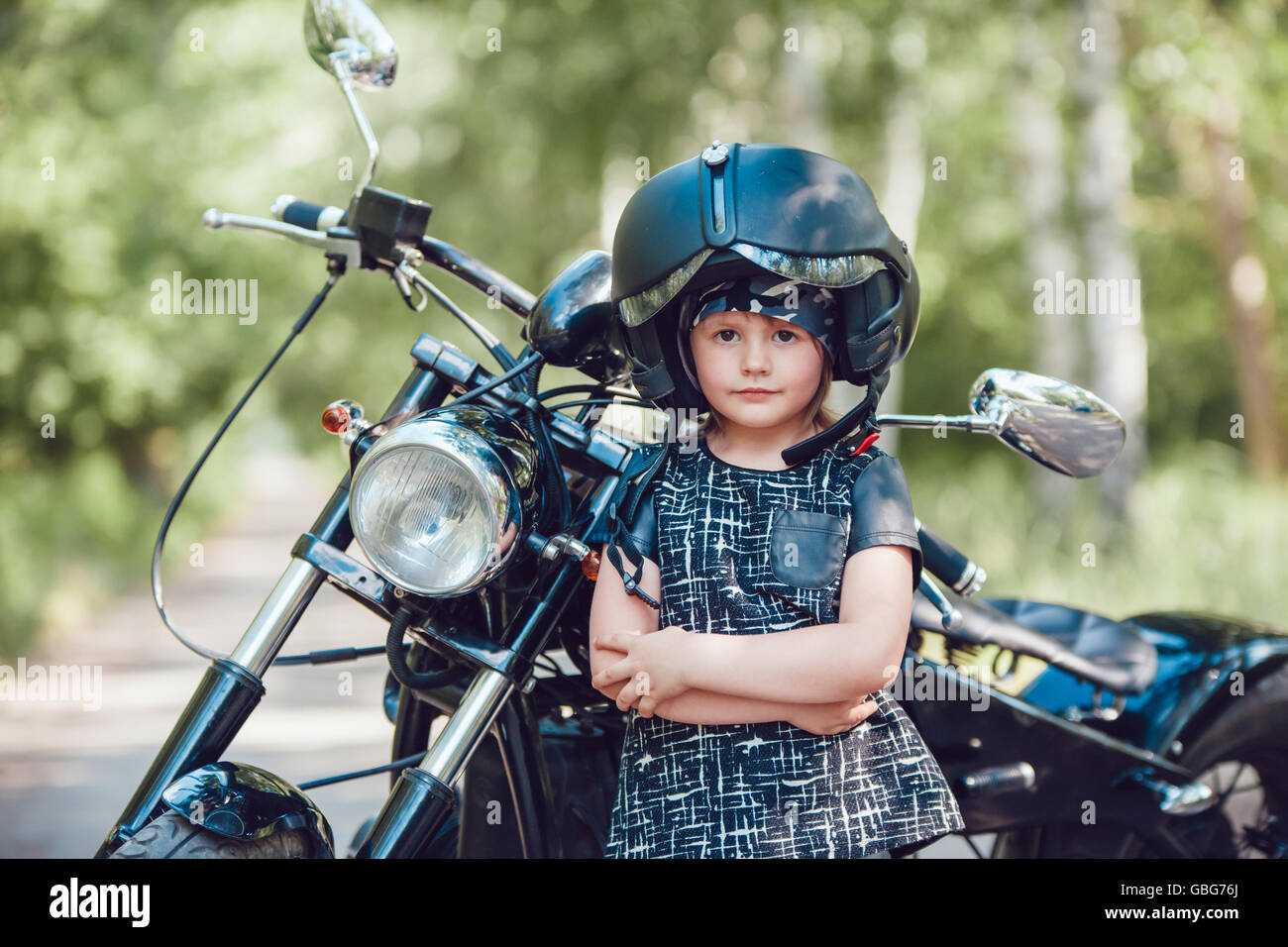 Little girl on a motorcycle Stock Photo - Alamy