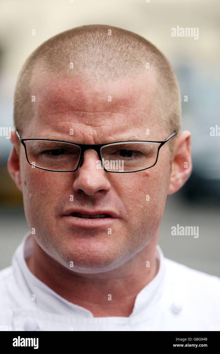 Heston Blumenthal poses for photographers outside his Fat Duck