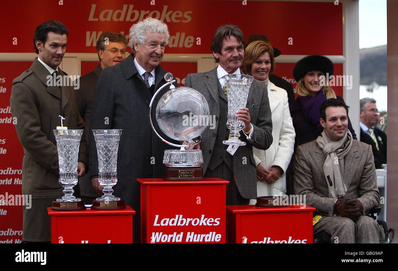Horse Racing - Cheltenham Festival 2009 - Day Three - Cheltenham Racecourse. The Stewart Family represented by Andrew Stewart collect their trophy after winning the Ladbrokes World Hurdle with Big Buck's. Stock Photo