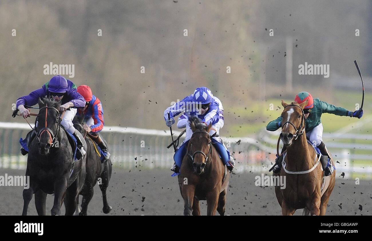 Badge Of Honour and Greg Fairley (right) battle on to win The freebets.co.uk Over 1000 In Free Bets Handicap Stakes from Gaily Noble and Fergus Sweeney (left) at Lingfield Park Racecourse, Surrey. Stock Photo