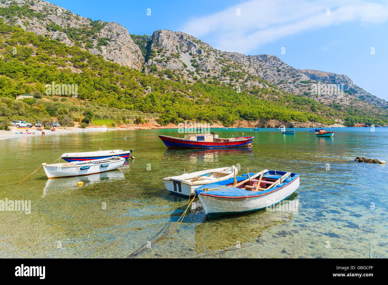 Traditional fishing boats in sea bay on secluded beach, Samos island, Greece Stock Photo