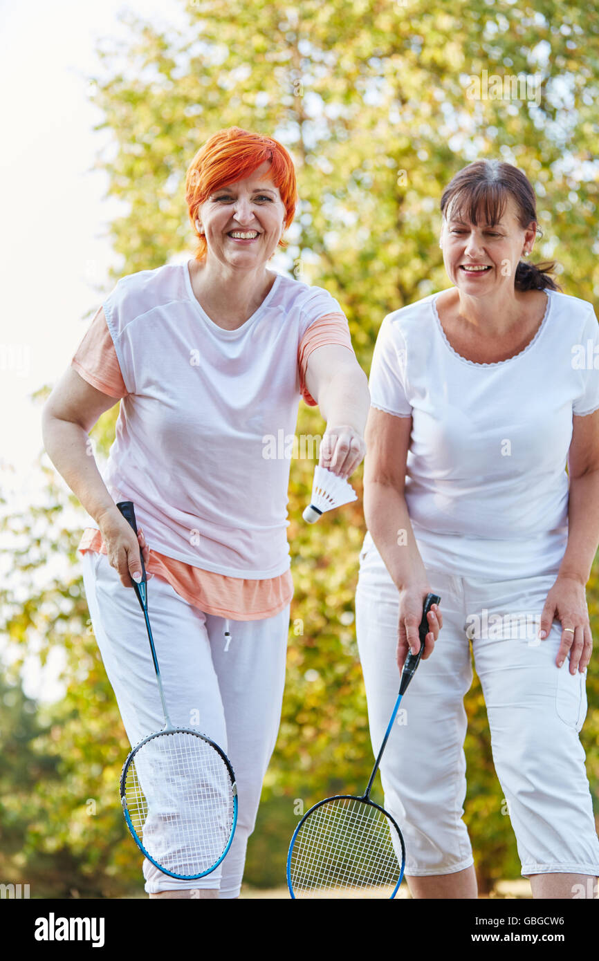 Two women playing badminton in the nature having fun Stock Photo Alamy