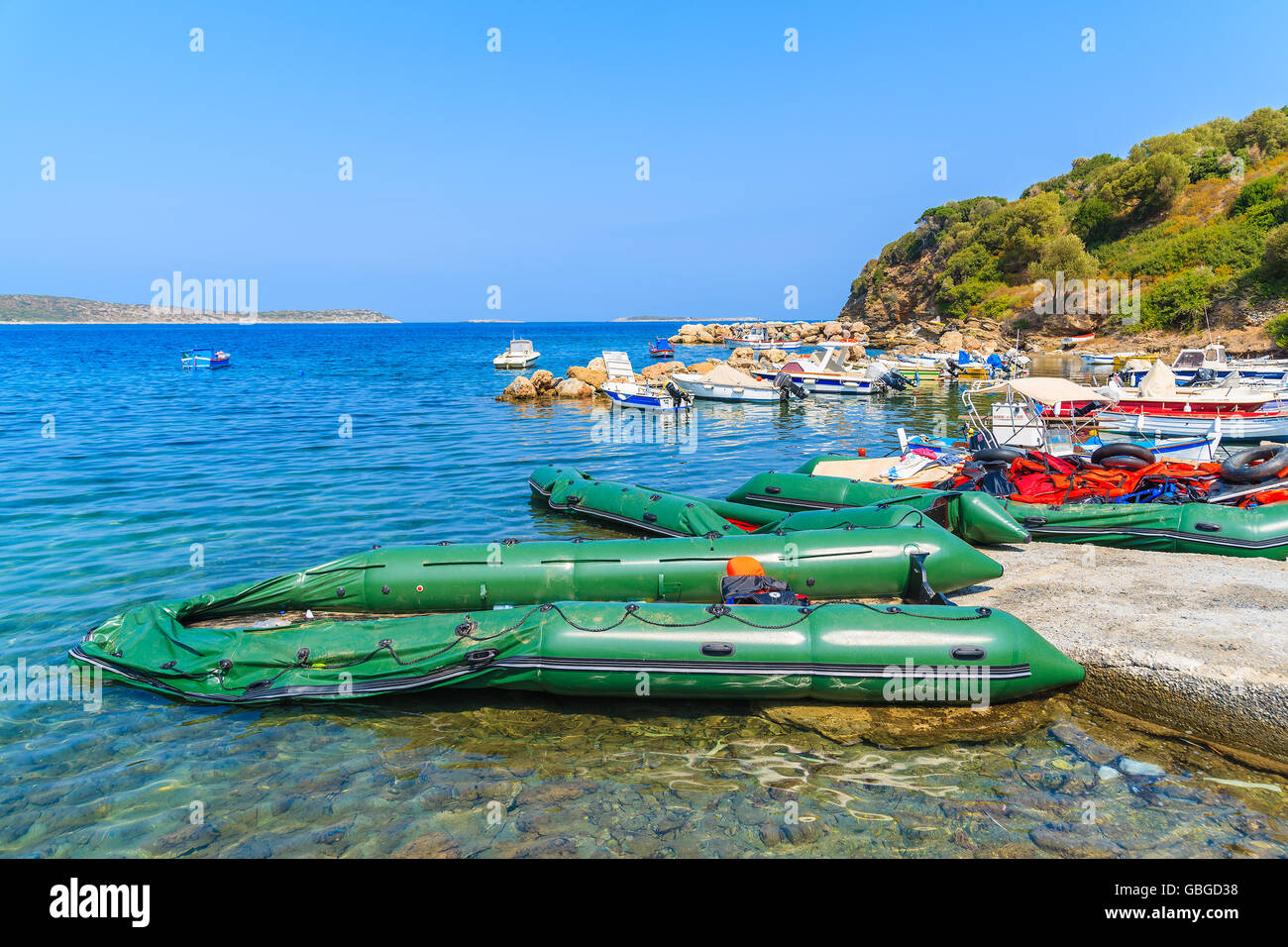 SAMOS ISLAND, GREECE - SEP 20, 2015: inflatable boats in small bay on coast of Samos island, Greece. Refugees arrive here from T Stock Photo