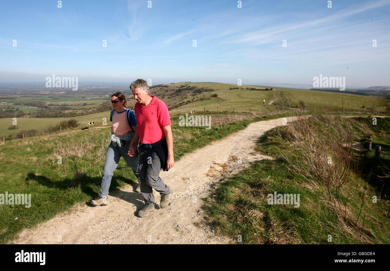 Walkers at Ditchling Beacon on the South Downs in Sussex as a decision is due into whether the South Downs will be given National Park status. Stock Photo