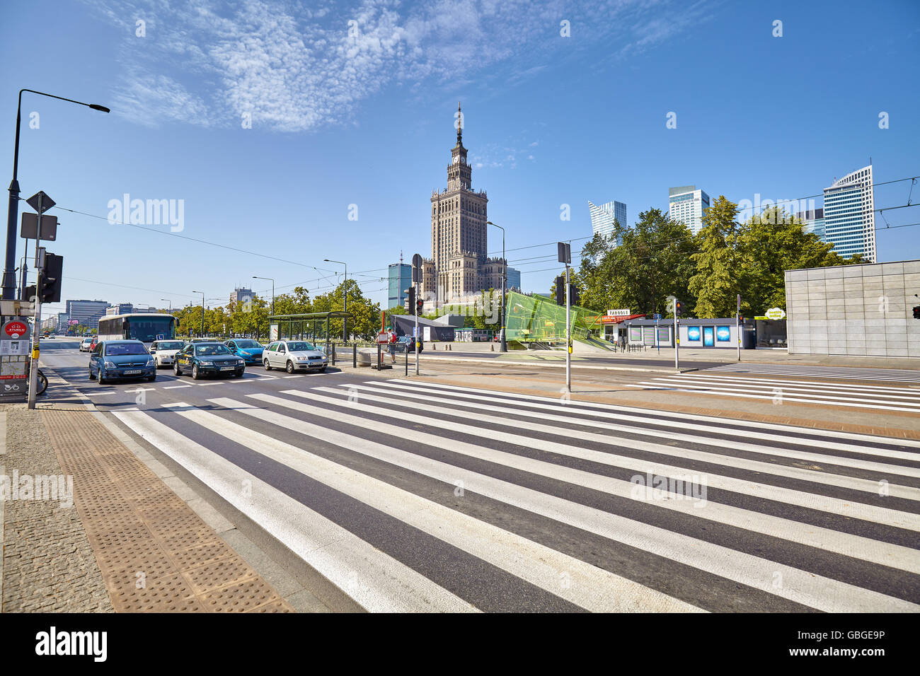 Warsaw, Poland - 26 June 2016: Pedestrian crossing in front of the Palace of Culture and Science, best known city landmark. Stock Photo