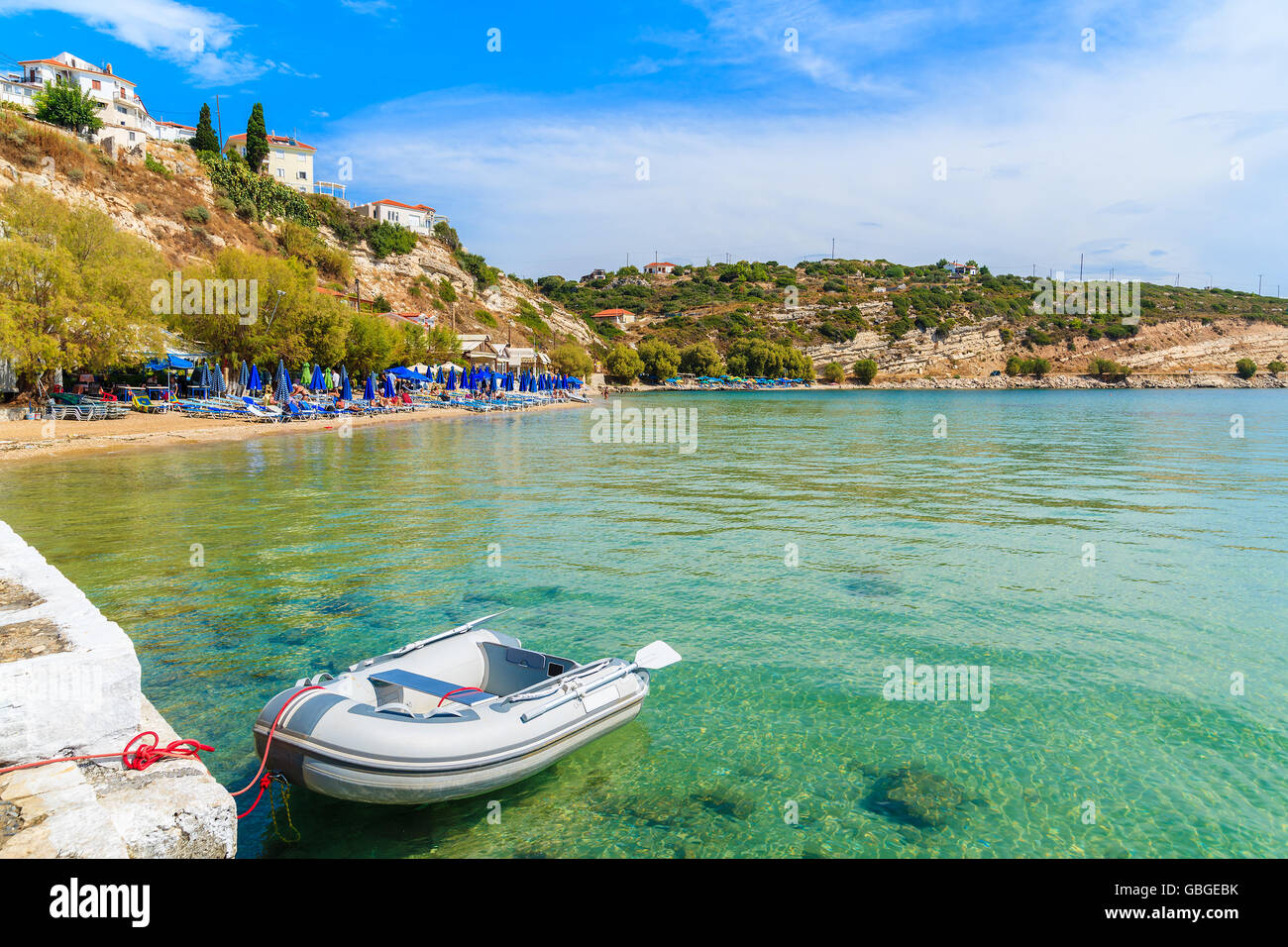 Dinghy boat on turquoise sea water at Pythagorion beach, Samos island, Greece Stock Photo