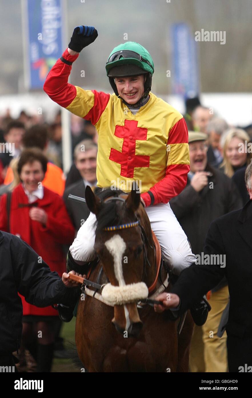 Jockey Tom O'Brien celebrates after winning the Fred Winter Juvenile Novices' Handicap Hurdle with Silk Affair. Stock Photo