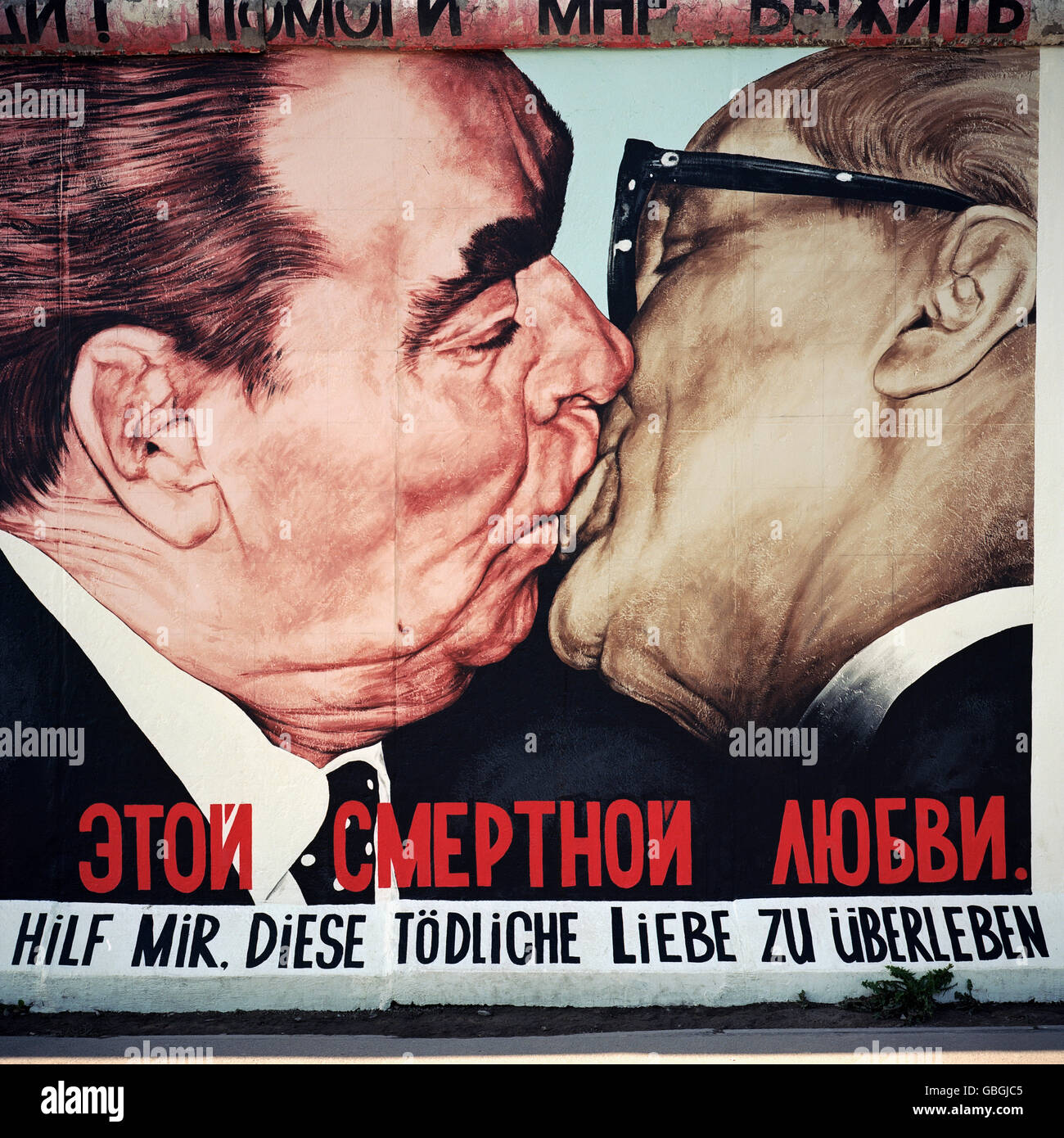 Berlin. Germany. Berlin Wall, The East Side Gallery. Caricature of Leonid Brezhnev & Erich Honecker kissing by artist Dmitri Vrubel. Stock Photo