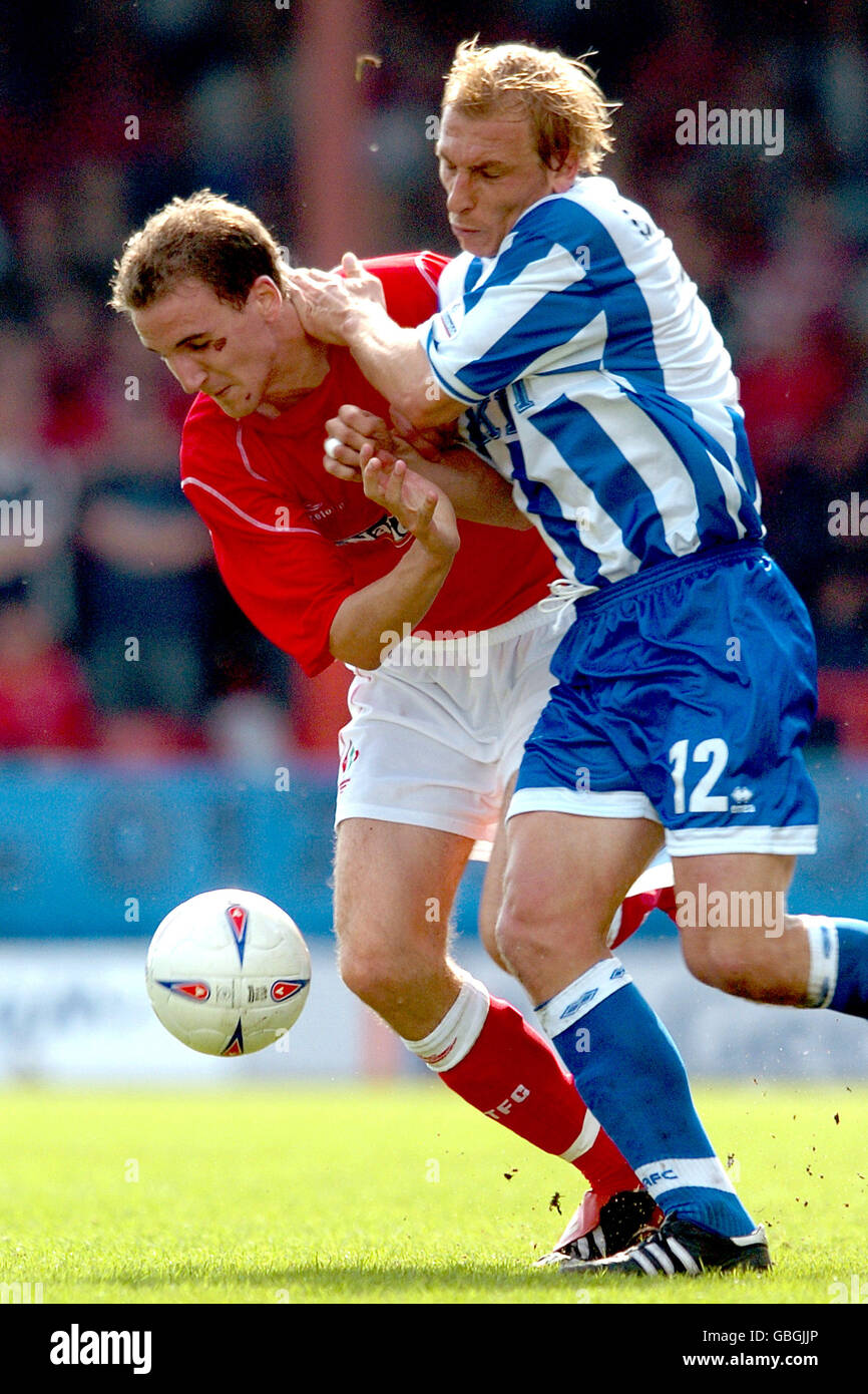 (L-R) Swindon Town's Andrew Nicholas and Brighton & Hove Albion's Richard Carpenter battle for the ball Stock Photo