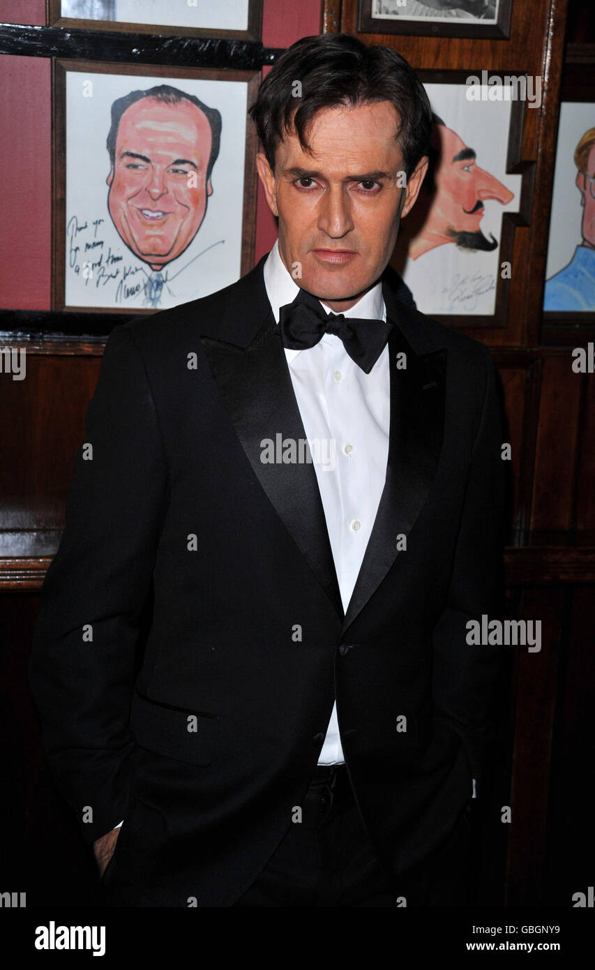 Actor Rupert Everett attends the afterparty for the Broadway opening night of 'Blithe Spirit' held at Sardi's in New York City. Stock Photo