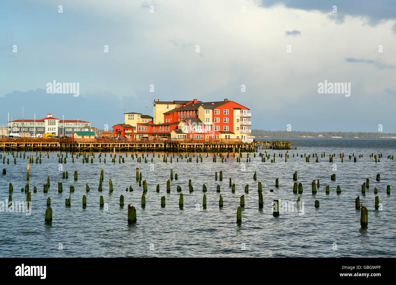 Buildings on Cannery Pier, Columbia River and wood pylons, Astoria, Oregon USA Stock Photo
