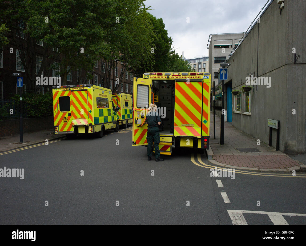 London Ambulance vehicles parked in streets outside the Ambulance service dept Stock Photo