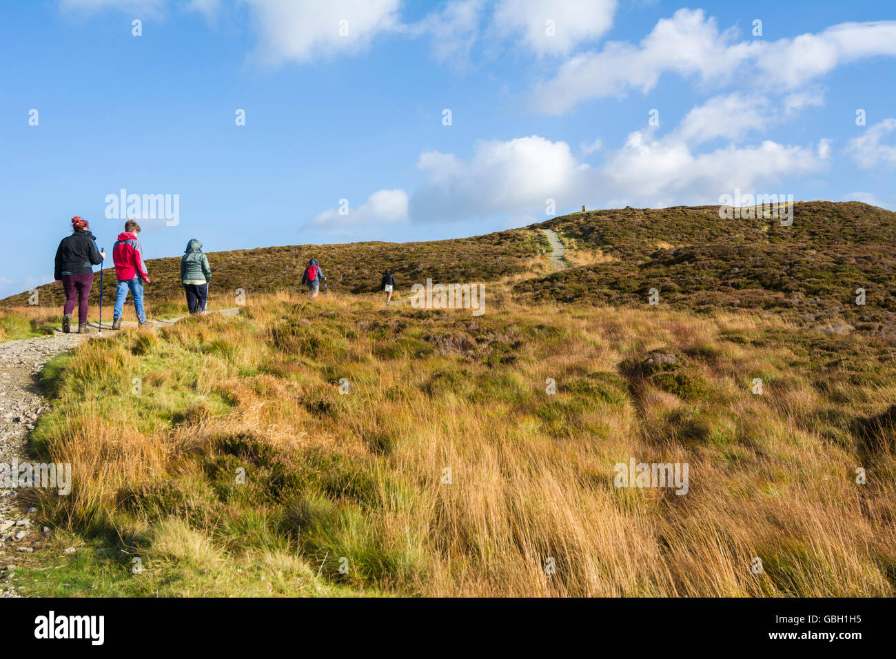 People walking on Gowbarrow Fell near Ullswater in the Lake District National Park, Cumbria, England. Stock Photo