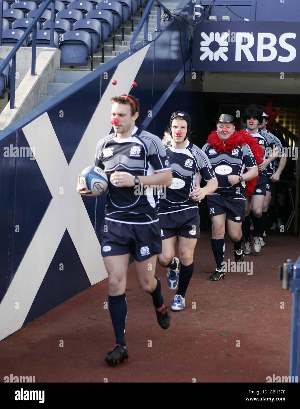 Scotland captain and scrum-half Mike Blair, Phil Godman, Matt Mustchin, coach Gregor Townsend, team manager Guy Richardson and kit manager Ryan Krause with red noses for Comic Relief at Murrayfield Stock Photo