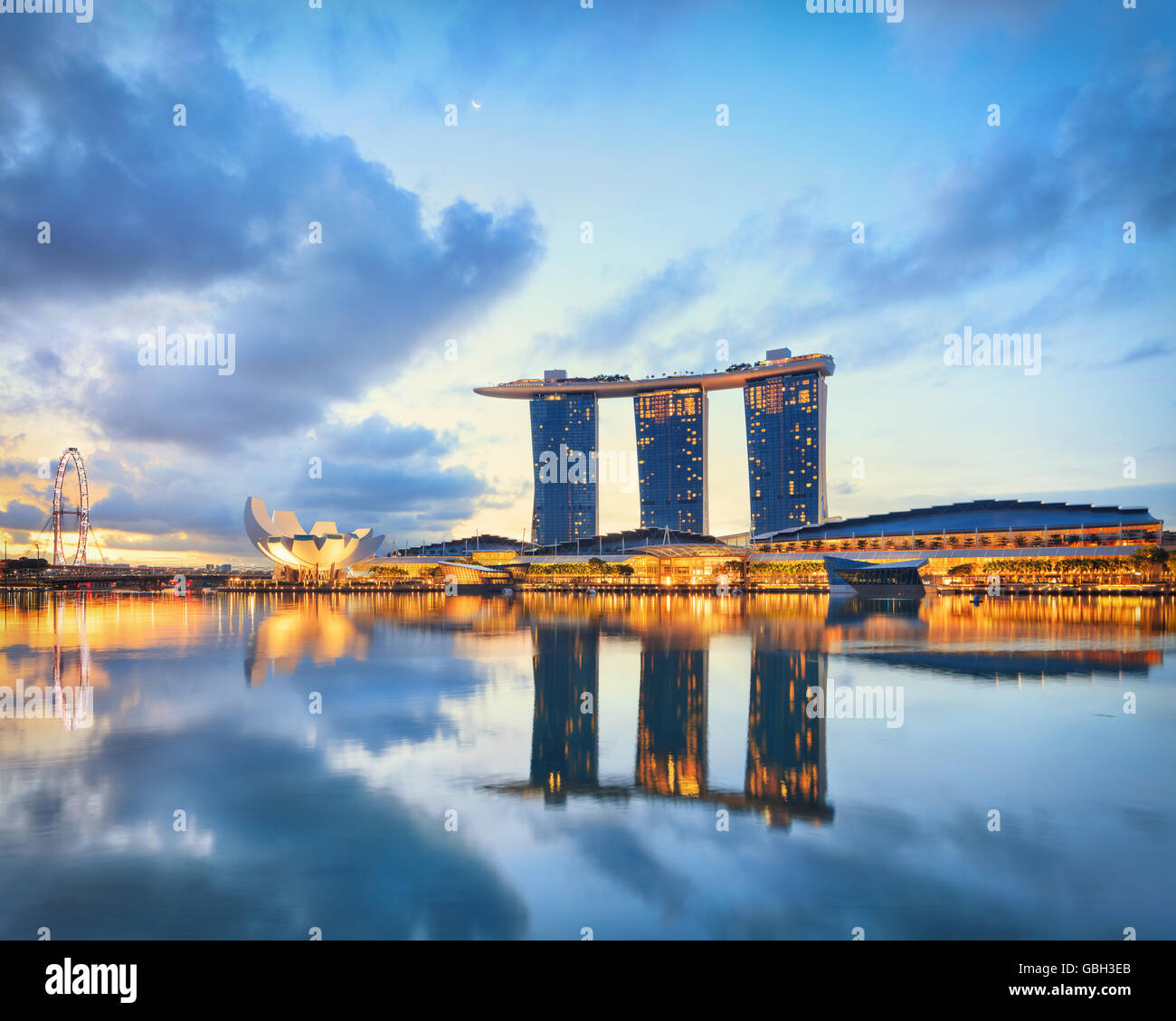View on Marina Bay with docks on foreground. Modern city architecture at sunrise Stock Photo