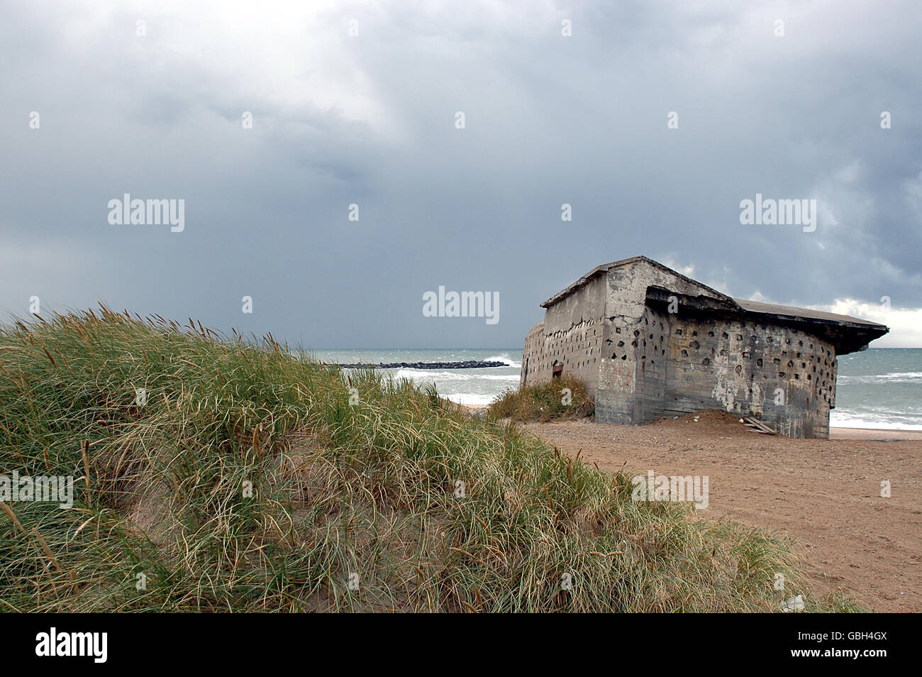 Atlantic wall remains at the beach of Thyborøn. These bunkers and strong points are left behinds from WW2 Stock Photo