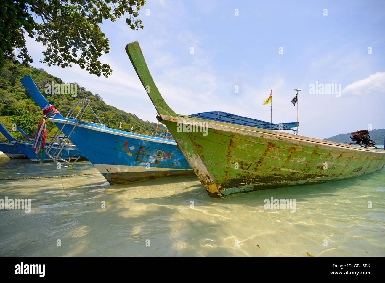 Traditional colored Thai boats at Surin Islands Nga Pang, Thailand Stock Photo