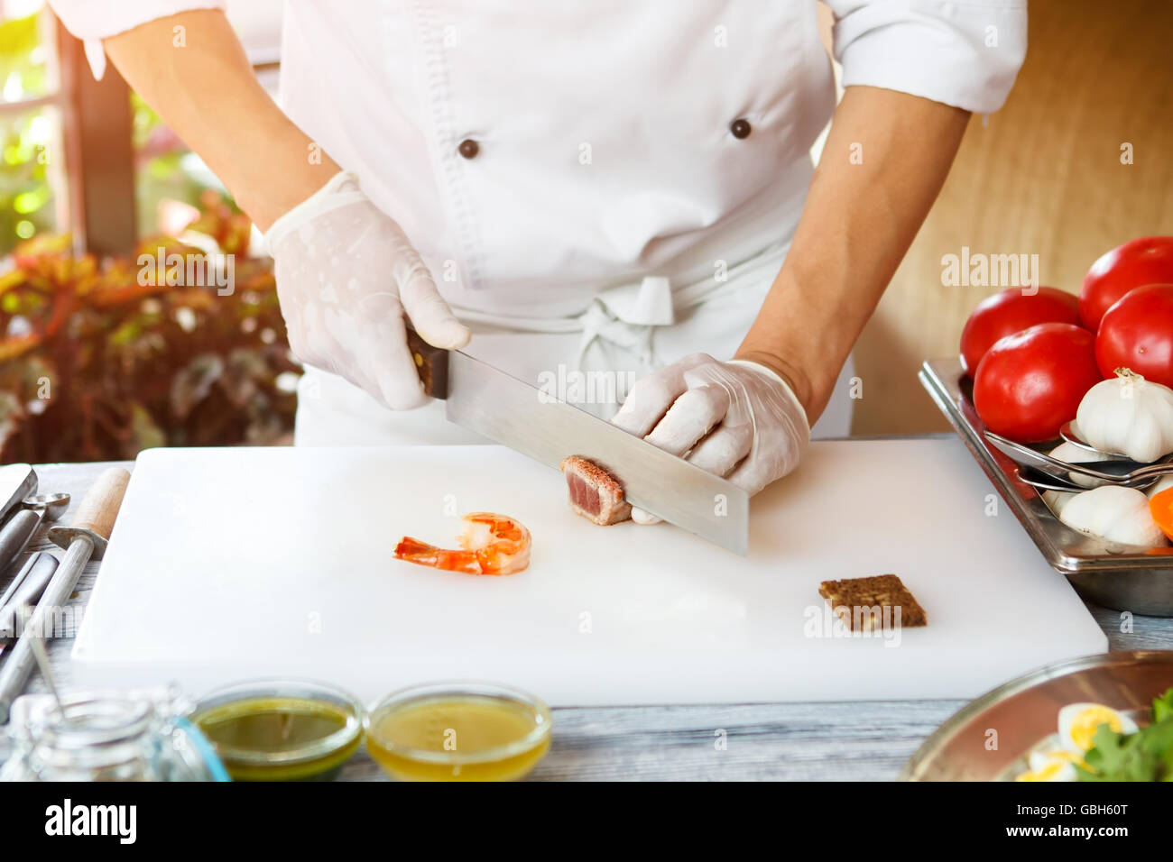 Hand with knife cuts meat Stock Photo Alamy