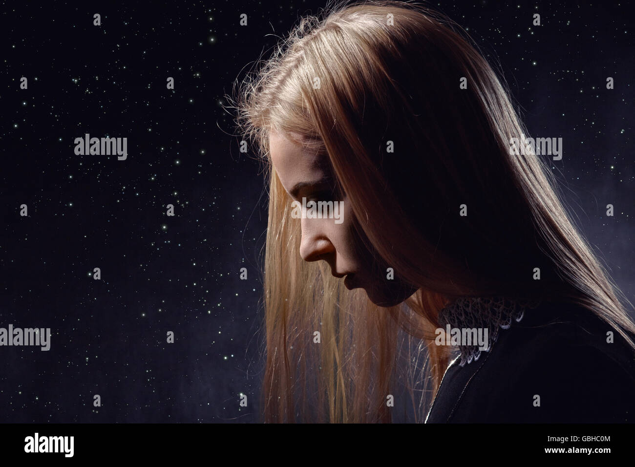 Sad Pensive Girl Profile On Stars Sky Background Stock Photo