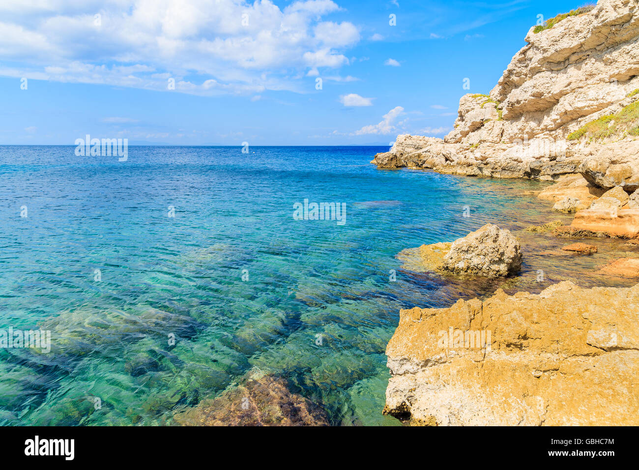Crystal clear sea water of Aegean Sea at Kokkari beach, Samos island, Greece Stock Photo