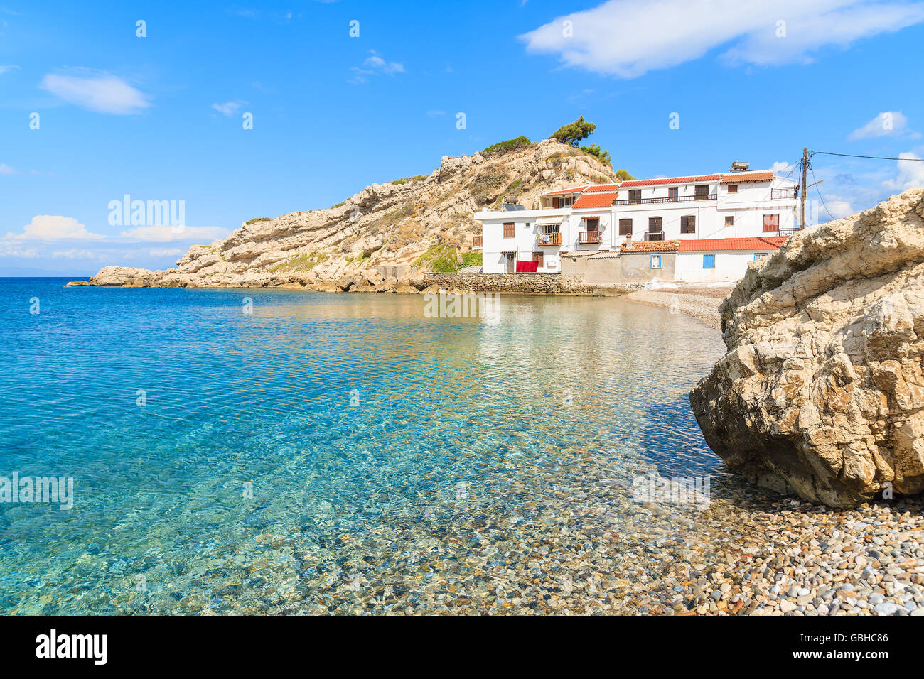 Crystal clear sea water of Kokkari beach, Samos island, Greece Stock Photo