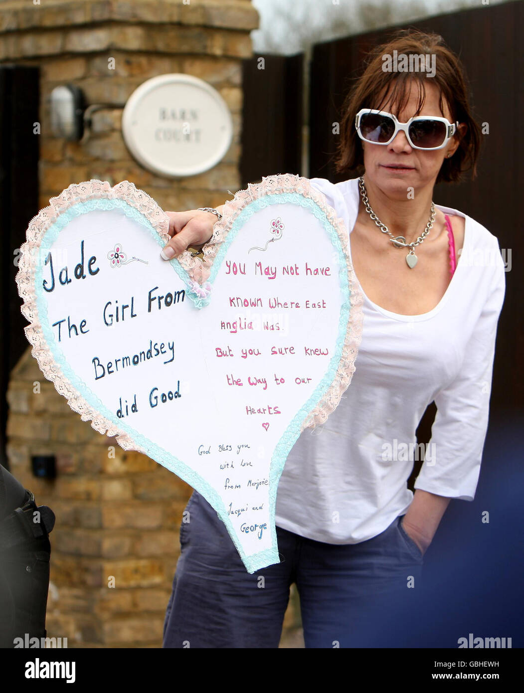 Jackiey Budden the mother of Jade Goody looks at tributes left outside her daughters home in Upshire, Essex, after her death was announced at the weekend. Stock Photo