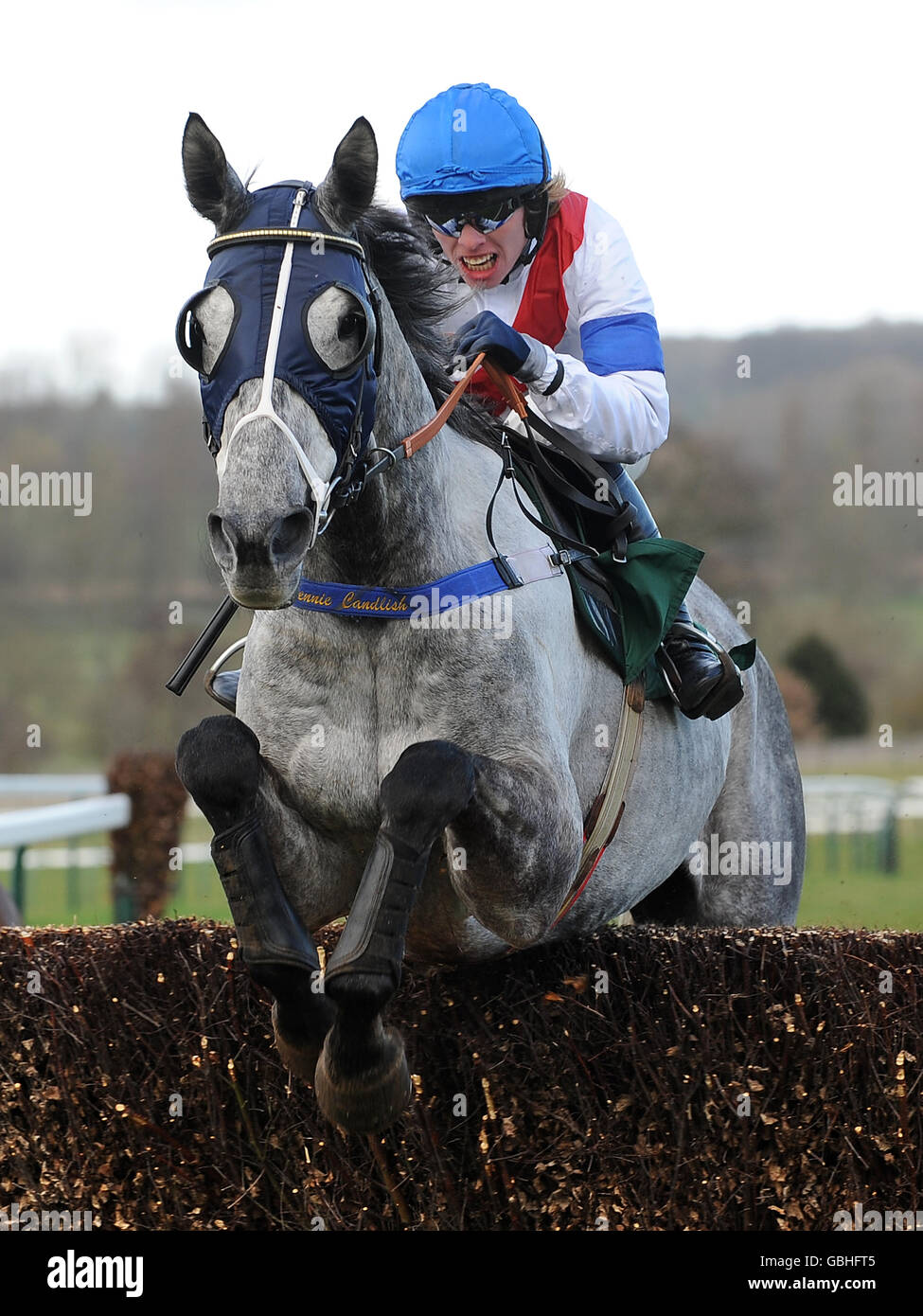 Jockey Alan O'Keeffe on Tomillielou jumps the last in the Bet On-line At Ladbrokes.com Handicap Chase Stock Photo