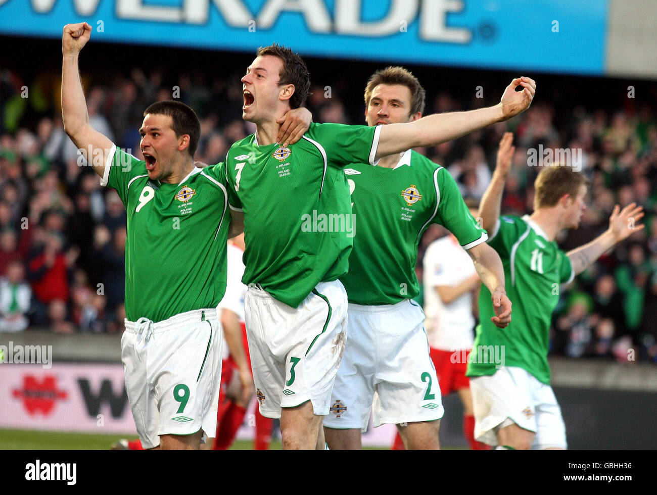 Northern Ireland's Jonny Evans (centre) celebrates scoring their second goal of the game with teammate David Healy (left) during World Cup Qualifying match at Windsor Park Stadium, Belfast, Northern Ireland. Stock Photo