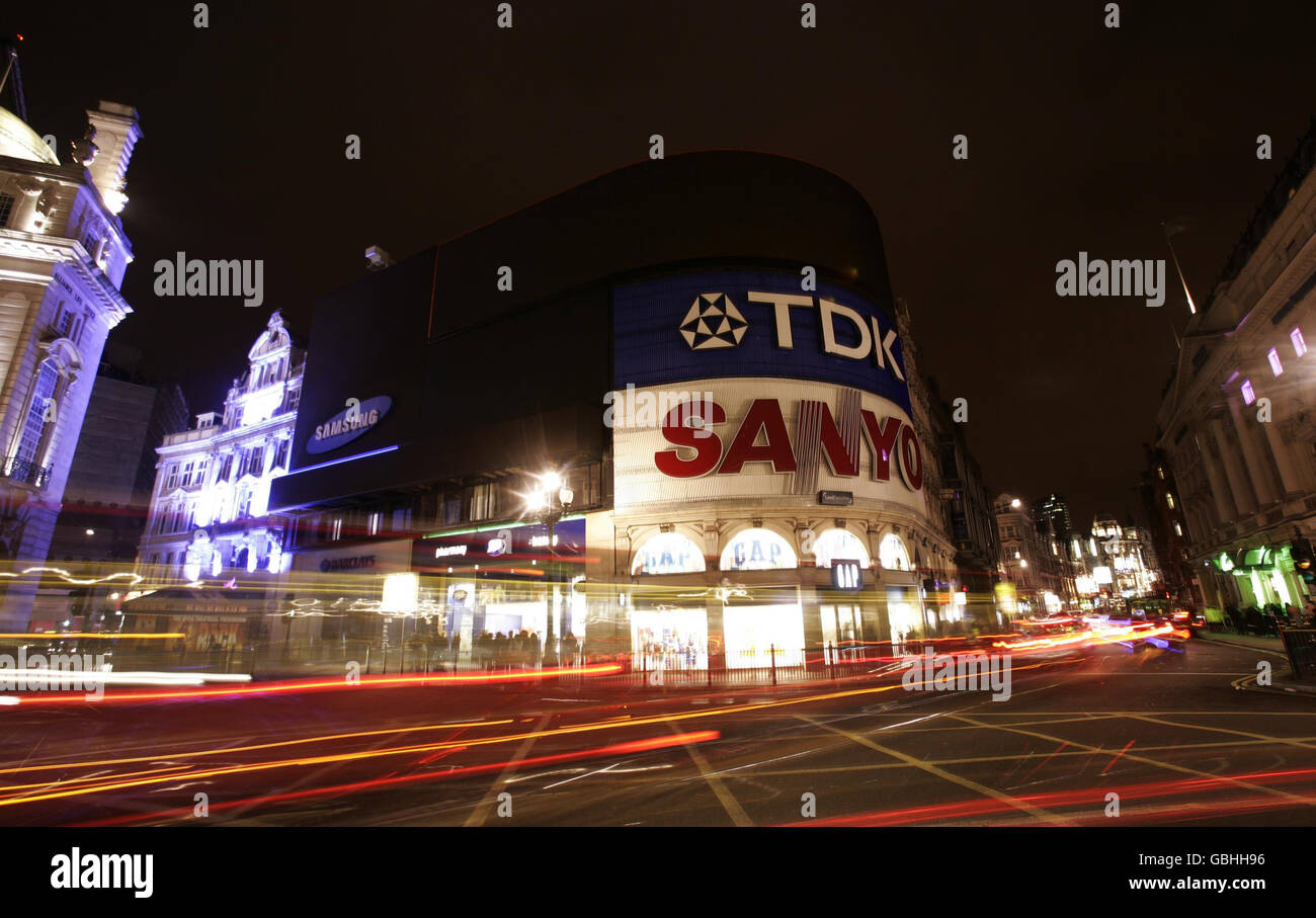 A general view of Piccadilly Circus, London, with the lights off during Earth Hour. Stock Photo
