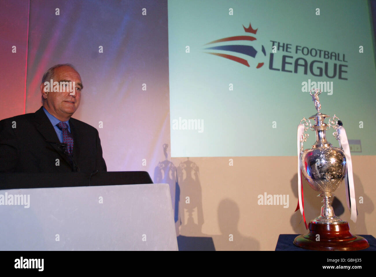 Chairman of the Football League Sir Brian Mawhinney with the new logo in the background Stock Photo