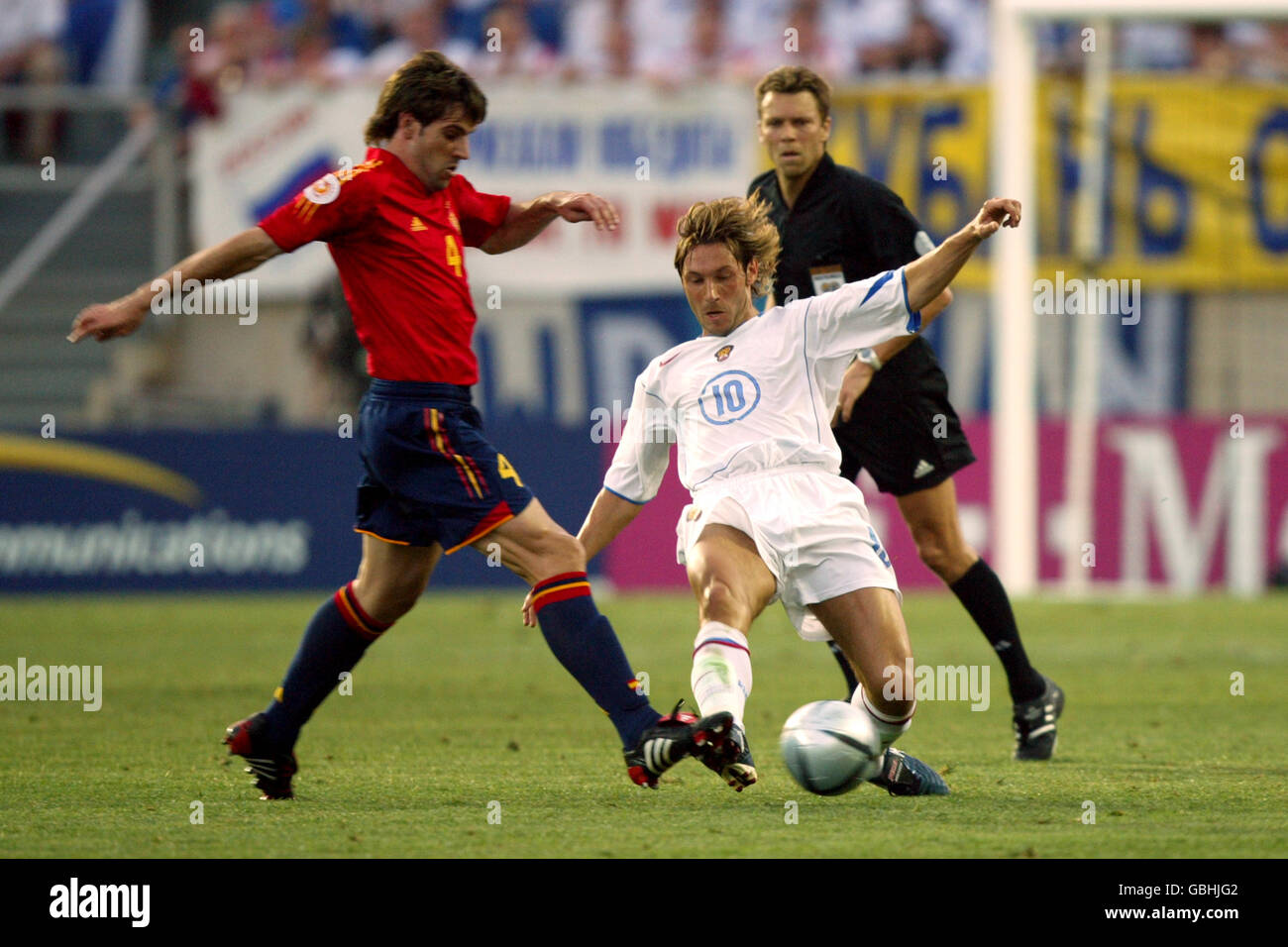 Soccer - UEFA European Championship 2004 - Group A - Spain v Russia. Spains David Albelda and Russia's Alexandre Mostovoi Stock Photo