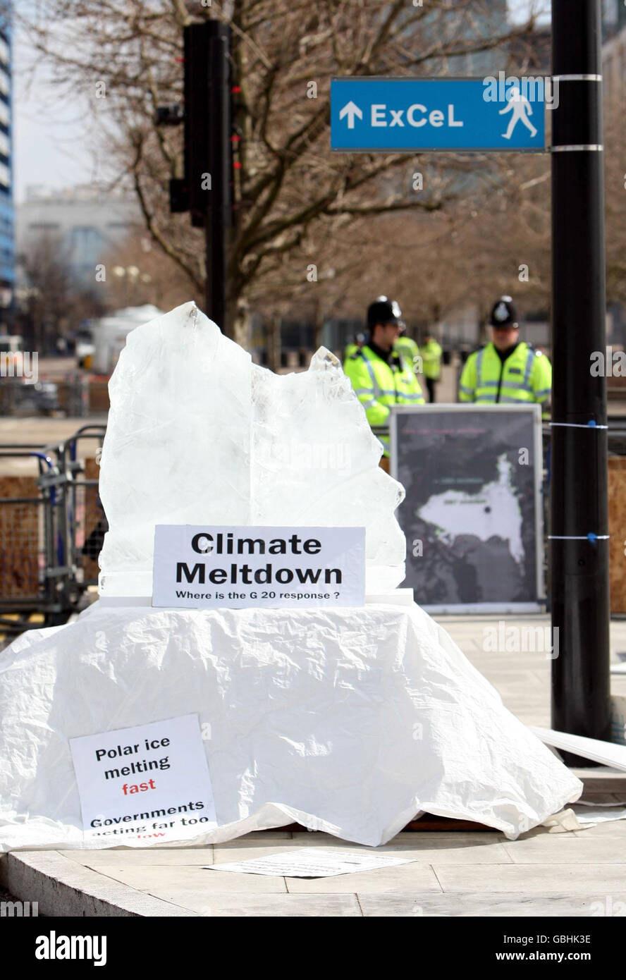 A ice sculpture of an melting Iceberg sits outside the ExCeL centre in
