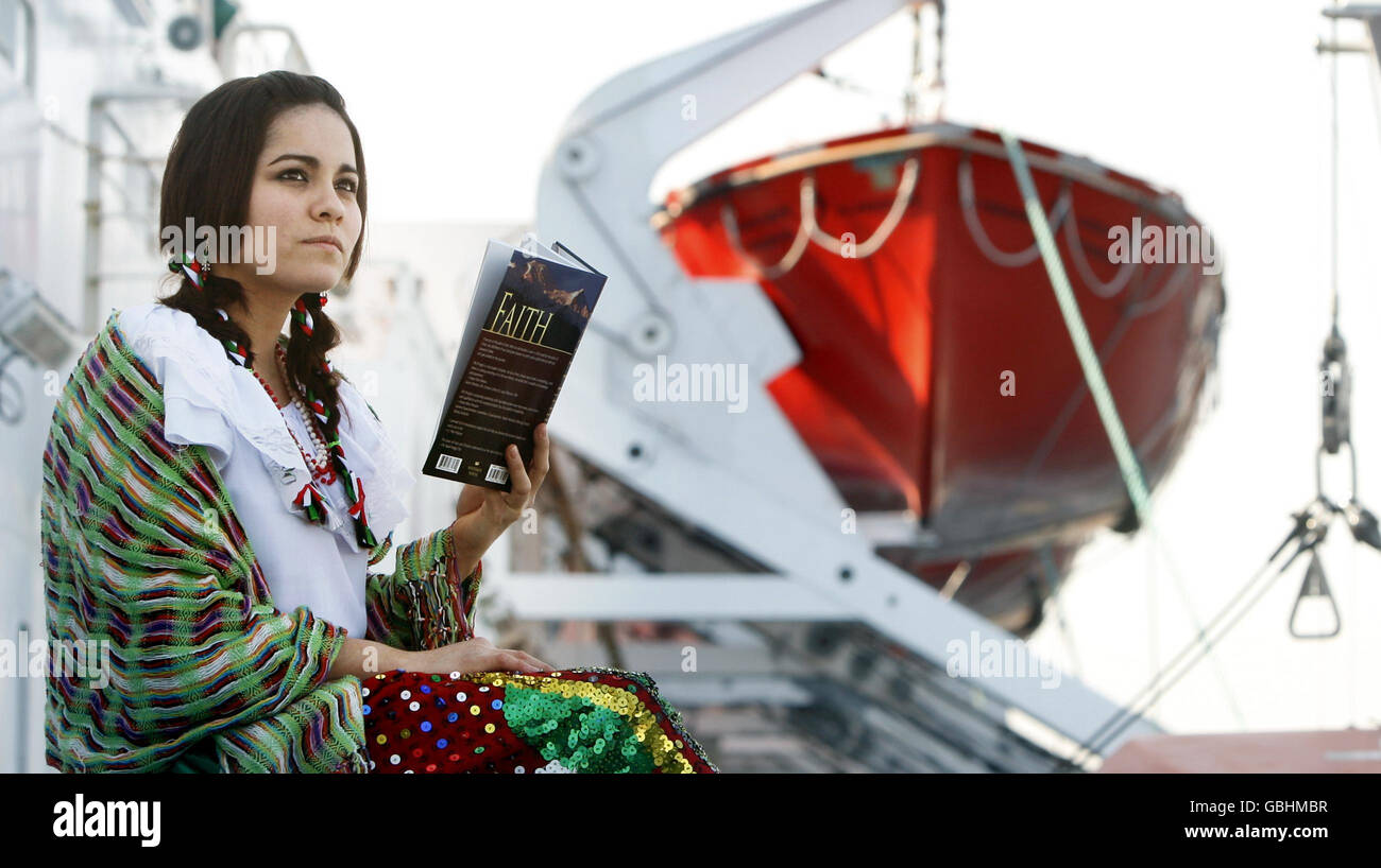 Sigrid Rodriguez from Mexico reads a book on the deck of Logos Hope, the worlds largest floating book fair, docked at the port of Leith in Edinburgh. Stock Photo